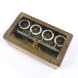 A fine quality 4-dial time lock for a commercial safe, with brass mechanism and enamel dials, signed