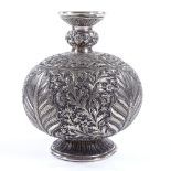 An Indian or Islamic unmarked white metal hookah pipe base, with finely chased and engraved floral