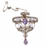 An Edwardian 9ct gold amethyst and split-pearl pendant/brooch, openwork scrolled floral settings,