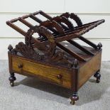 An early 19th century rosewood Canterbury, with carved x-shaped divisions, a single drawer below,