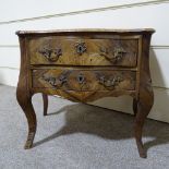 A 19th century miniature French rosewood bombe chest of 2 long drawers, on cabriole legs, with