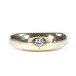 A 9ct gold solitaire diamond gypsy ring, setting height 6.4mm, size P, 5.1g