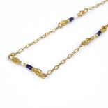 A Korean unmarked gold and enamel necklace, necklace length 44cm, 11.2g