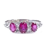 An Edwardian 18ct white gold 7-stone ruby and diamond half-hoop ring, with engraved bridge and