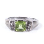 A 9ct white gold peridot and diamond dress ring, with openwork bridge, setting height 5.7mm, size I,