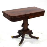 A 19th century rosewood fold over card table, with marquetry inlaid frieze, and carved base, width