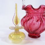 A Victorian cranberry and clear glass basket, height 22cm, and a small iridescent yellow glass