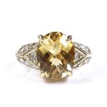 A 9ct gold faceted citrine dress ring, with diamond set shoulders, setting height 11.2mm, size K, 5g