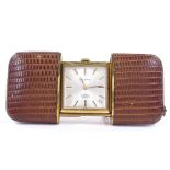 A gold plated and leather-cased Mappin travelling timepiece, 17 jewel movement, folding stand with