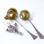 A Continental silver toddy ladle, length 16cm, a Continental silver sugar sifter spoon, and an