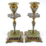 A pair of Victorian brass and champleve enamel candlesticks, with onyx-mounted bases, height 16cm