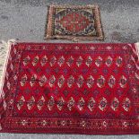 A Tekke Turkoman rug 147cm x 105cm, and a Persian bagface 72cm x 61cm (2)