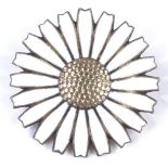 An Anton Michelsen Danish sterling silver-gilt and white enamel daisy brooch, brooch diameter 42.
