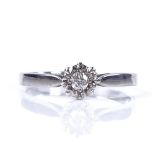 A 9ct white gold solitaire diamond ring, diamond approx 0.08ct, setting height 5.5mm, size M, 1.9g