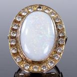 A large unmarked gold opal and white stone cluster dress ring, setting height 37.4mm, size approx T,