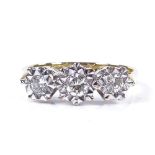 An 18ct gold diamond trilogy ring, total diamond content approx 0.72ct, setting height 6.5mm, size