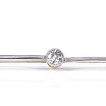 An unmarked gold solitaire diamond bar brooch, diamond approx 0.19ct, brooch length 75.9mm, 3.3g