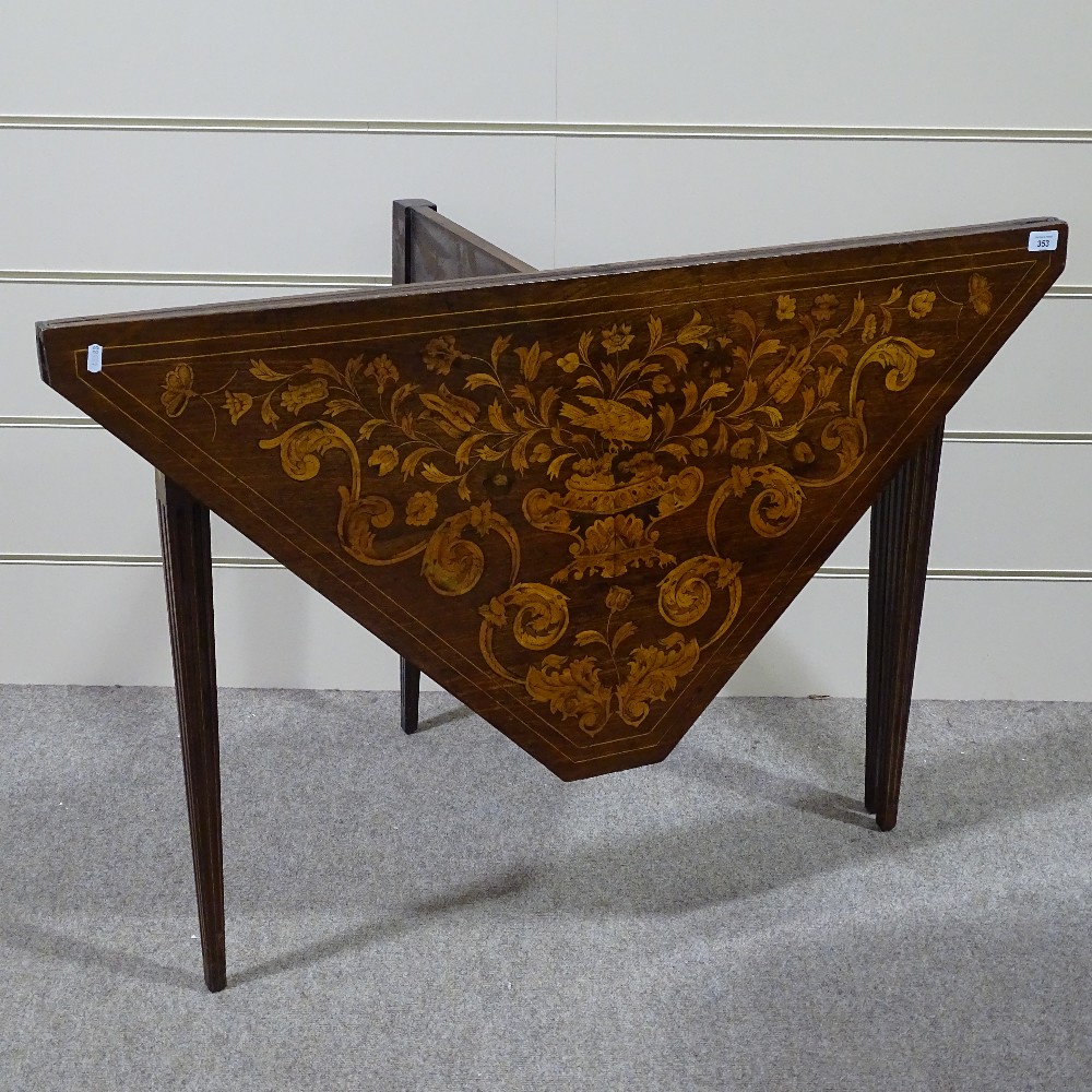 An 18th century Dutch marquetry folding card table, on original fluted tapered and inlaid legs,