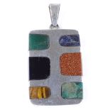 A Mexican sterling silver and hardstone abstract rectangular pendant, set with gold stone, tiger's