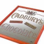 A Victorian Cadbury's Chocolate advertising wall mirror with pictorial designs, modern frame,