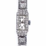 A lady's platinum and diamond encrusted cocktail wristwatch, total diamond content approx 2ct,