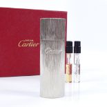 A modern Cartier textured metal perfume bottle, new boxed condition