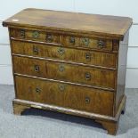 A 19th century walnut bachelor's chest of drawers of small size, in Georgian style, with crossbanded