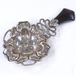 A Scandinavian silver Viking revival style tea strainer, with turned wood handle and pierced