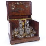 A 19th century French walnut drinks cabinet, inlaid mother-of-pearl and metal swan and exotic bird