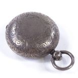 A Victorian circular silver sovereign case, with allover engraved foliate decoration, by Cornelius