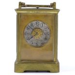 A French 8-day brass-cased carriage clock, with ornate silvered dial, repeat movement striking on