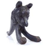 A Black Forest carved wood bear, length 21cm