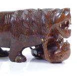A Chinese carved hardwood lion, length 26cm