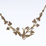 An Edwardian unmarked gold split-pearl collar necklace, with central figural bird and leaf