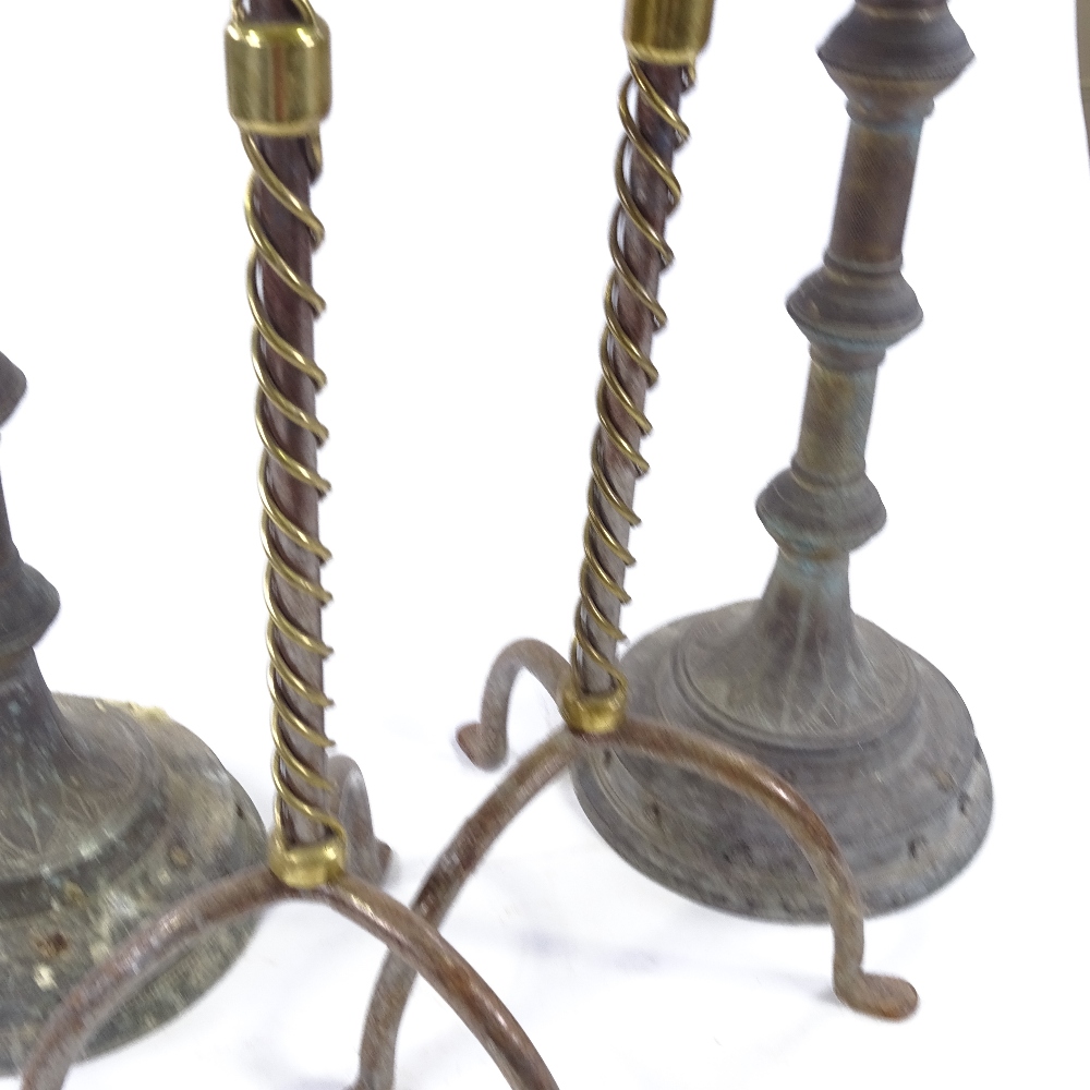 A pair of Victorian Gothic brass floor standing candle holders, height 95cm, and a pair of brass - Image 3 of 3