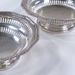 A pair of Edwardian circular silver bon bon dishes, with gadrooned rim and pierced border, by Vale