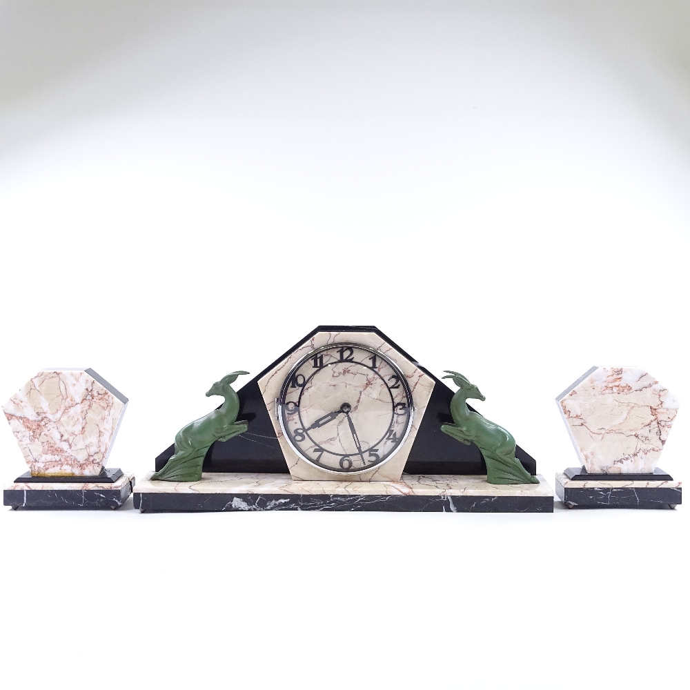 An Art Deco 2-colour marble-cased clock garniture, surmounted by green patinated spelter antelope, - Image 2 of 5