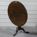 A 19th century circular mahogany occasional table on carved tripod base, 3' across