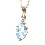 A 9ct gold topaz and diamond pendant necklace, on 9ct Prince of Wales chain, pendant height