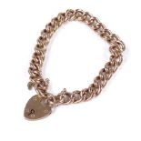 A 9ct rose gold curb link heart-lock charm bracelet, bracelet length 20cm, 18.5g
