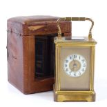 A small French 8-day brass-cased carriage clock, enamel dial, striking on a gong, case height