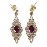 A pair of 9ct gold garnet drop earrings, open wirework settings, height excluding fitting 29.2mm,
