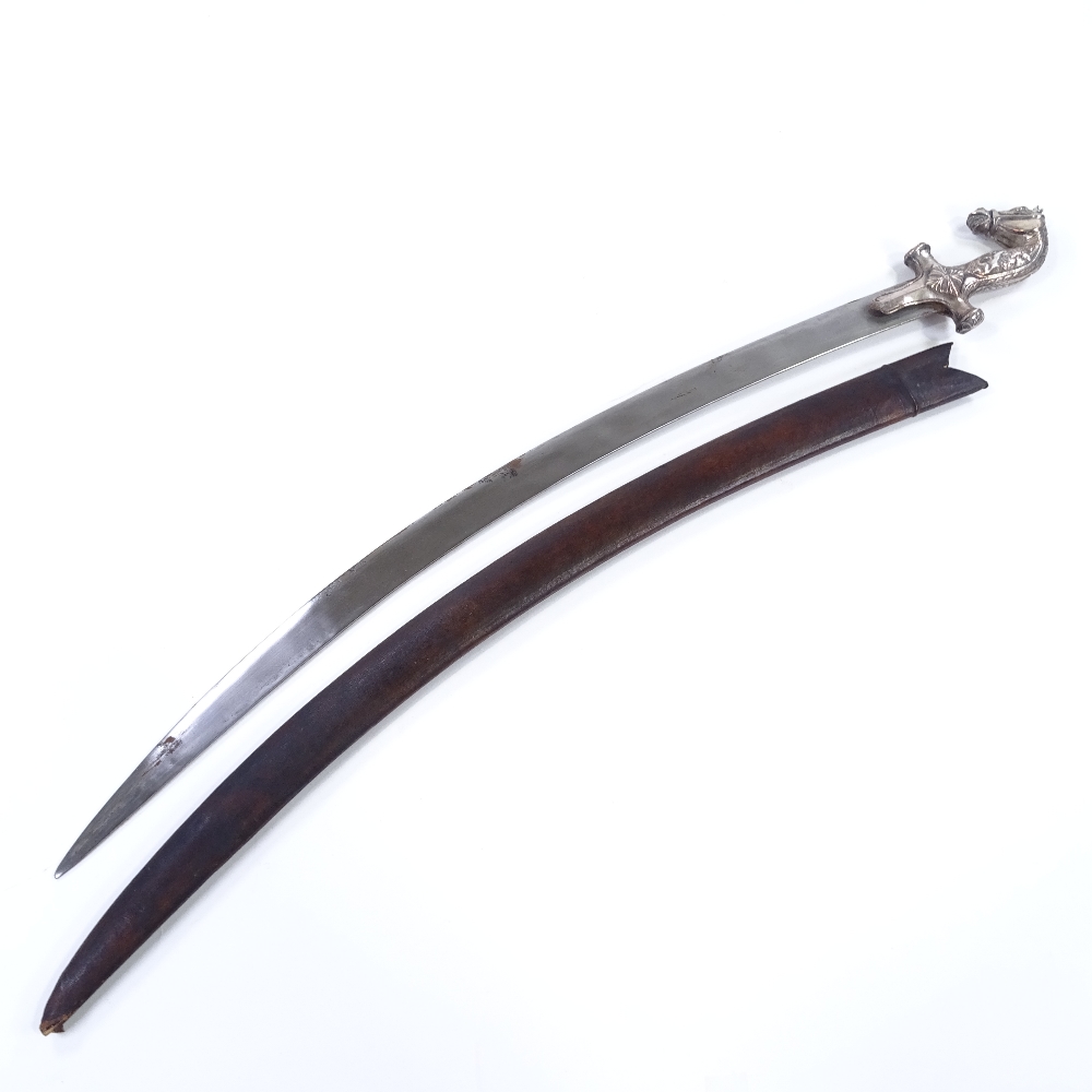 An Indian curved sword, with horsehead design hilt and lion and buffalo design grips, plain curved - Image 2 of 3