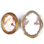 2 relief carved shell cameo brooches, depicting Classical female portraits, smallest in 9ct frame,