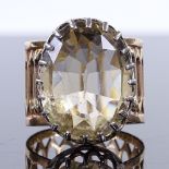 A Victorian large oval-cut citrine dress ring, unmarked pierced gold and silver settings, setting