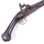 A Middle Eastern Flintlock pistol, engraved barrel with engraved lock and brass mounts, length 44cm