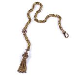 A 9ct gold fancy link chain, with 9ct dog clip and unmarked gilt-metal tassel, length 28cm, 8.6g