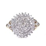 A 9ct gold diamond cluster snowflake ring, total diamond content approx 0.5ct, setting height 14.