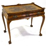 An early 20th century burr-walnut silver table, with carved and shaped galleried top, single ogee