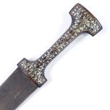 A Middle Eastern dagger, 18th or 19th century, with silver inlaid wood handle, and damascened blade,